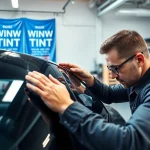 Find expert window tint near me with a technician applying premium tint to a luxury car.