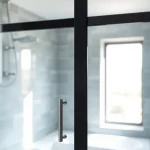 Highlighting a stylish black shower sliding door enhancing a modern bathroom design.