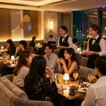 Guests enjoying drinks and entertainment at 강남쩜오 nightlife venue with elegant decor.