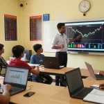Students learning at the leading stock market training institute in Kerala with interactive trading sessions.